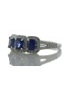 18ct White Gold Three Stone Emerald Cut Sapphire And Diamond Ring (S 1.20) 0.29